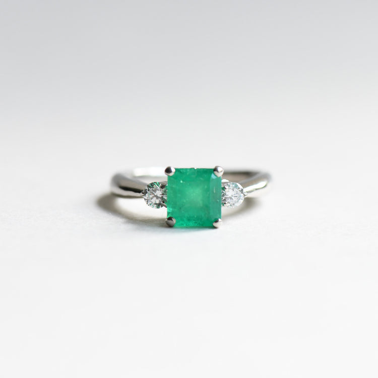Platinum Emerald Diamond Ring: 1.23 Carat Three Stone Estate Ring
